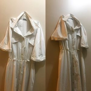 Colar dress, with a stripe coding. White with a side of navy blue and cream.